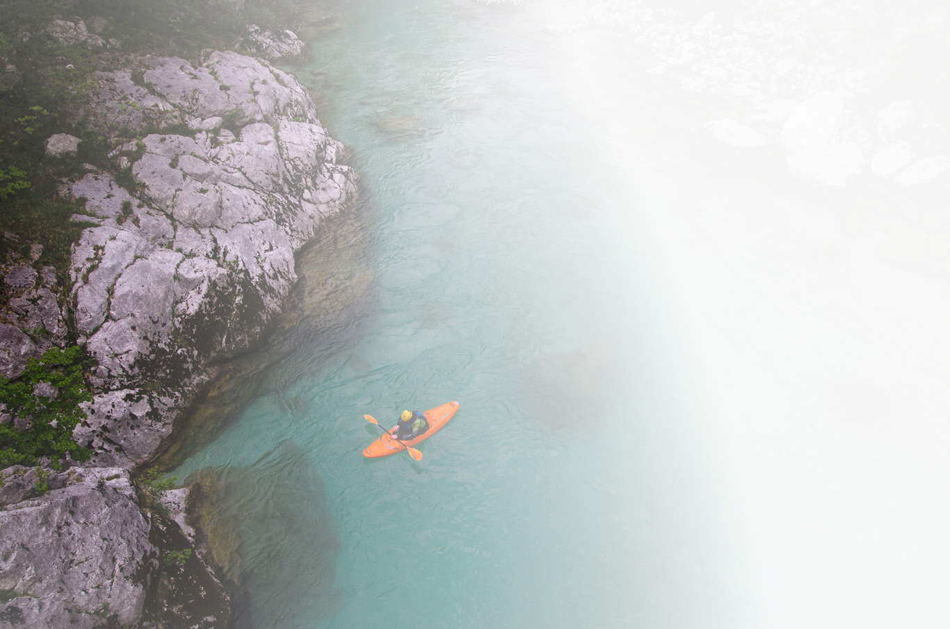 Section Background- View of kayak on beautiful lake with mountains in the background